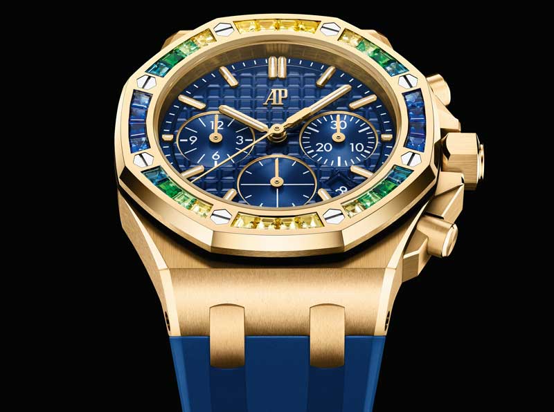 Amura,AmuraWorld,AmuraYachts, El reloj de oro amarillo con esfera azul real y bisel engastado con tsavoritas, zafiros amarillos y azules.