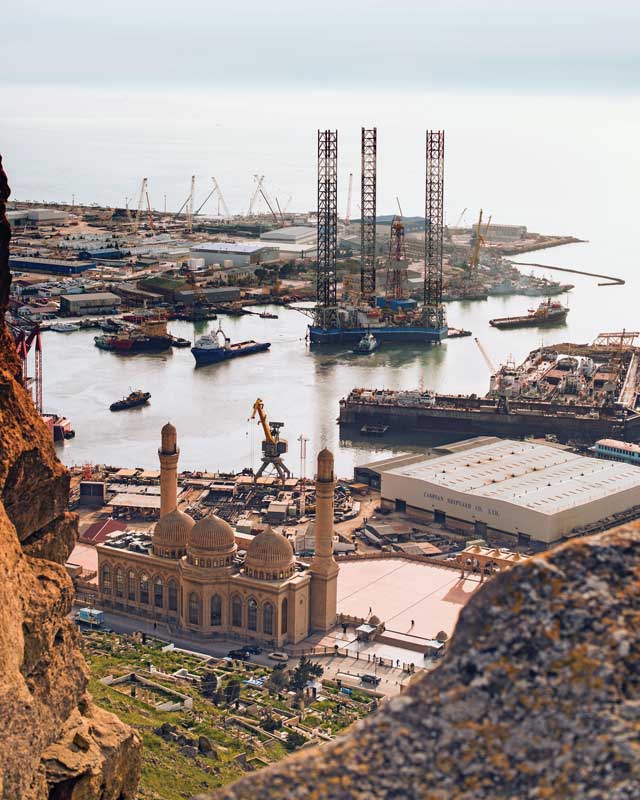 Bibi Heybat Mosque near oil derricks on the port of Baku.