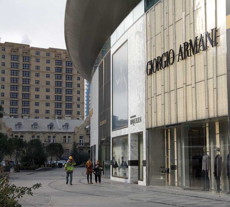 Shops, at Port Baku Mall. Azerbaijan Parliament in Baku, Azerbaijan.
