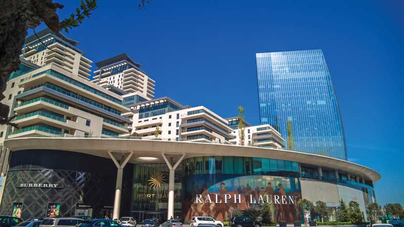 Shops, at Port Baku Mall. Azerbaijan Parliament in Baku, Azerbaijan.
