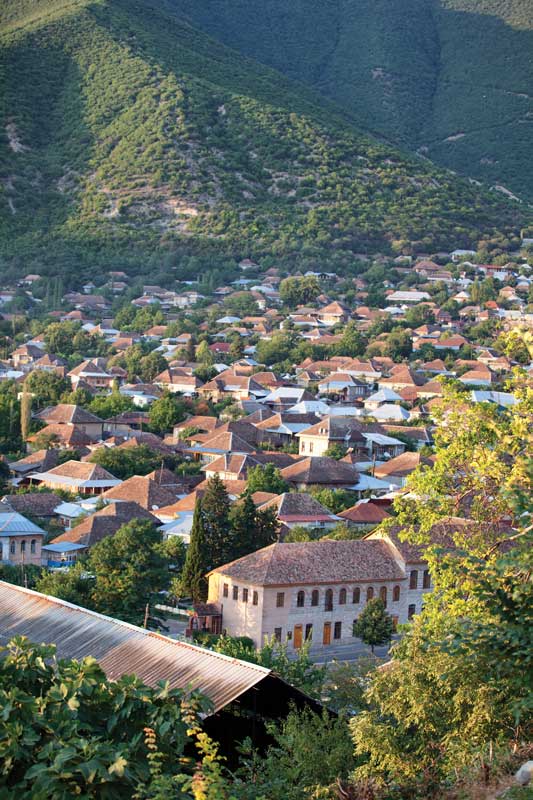 Panoramic view of the city of Shyeki, between mountains.
